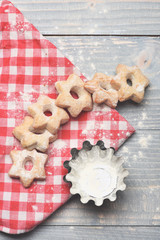 Tea cookies on grey wooden background. Star shaped biscuits