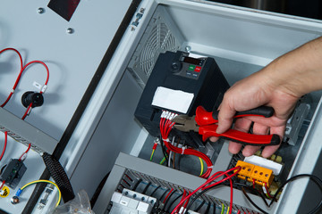 technician at maintenance work with an electric pump