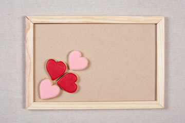 Valentine background and pink cookie on slate blackboard. Ideas for valentine's love concept.