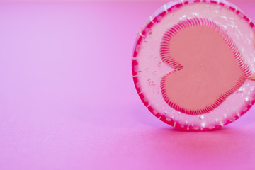 St. Valentine's Day or Anniversary concept with heart candies, pink background, close up