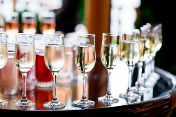 Glasses with champagne and cocktails.