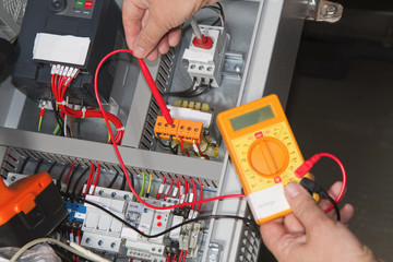 technician at maintenance work with an electric pump