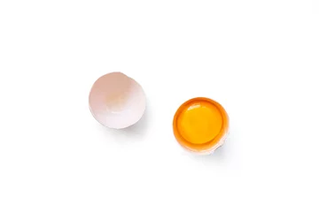 Foto op Plexiglas fresh brown organic chicken egg broken with yolk and egg white isolated on white background. Horizontal composition. Top view © ydumortier