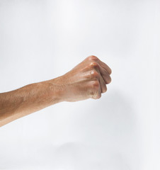 Hand with clenched a fist isolated on a white background.