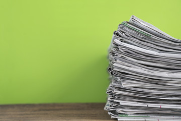 close up newspapers folded and stacked background on the table