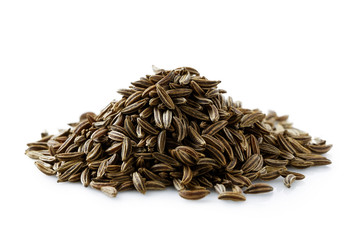 A pile of dry caraway or cumin seeds isolated on white.