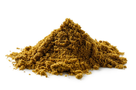 A pile of ground cumin isolated on white.