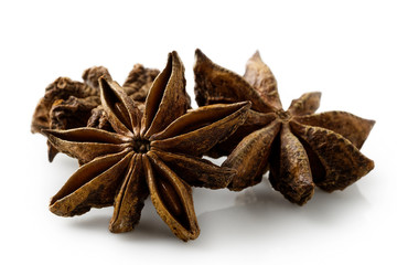 A group of star anise seeds isolated on white.