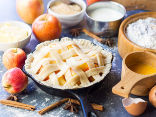 Making apple pie for autumn baking concept with dessert ingredients.