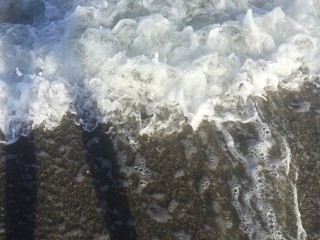 waves crashing on the sand