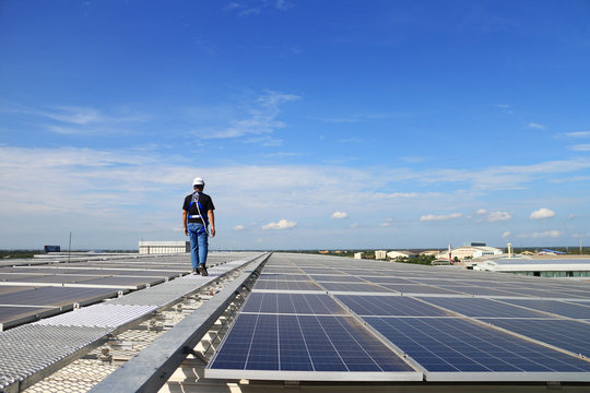 Solar PV Rooftop with Technician Walking