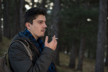 young man holding the cigar 