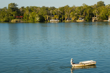 River called Dulce in Guatemala, department of Izabal, humid tropical climate, leafy forest and navigation