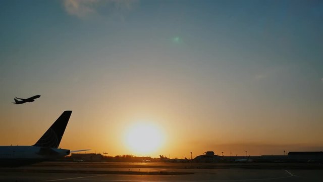 Plane taking off sky sunset sun dusk in airport China. Beijing.
