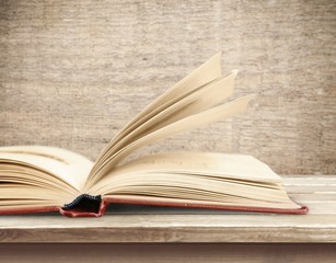 Old open book on table
