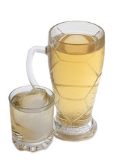 Glass jars with whiskey and ice on white background