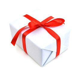 White gift box with red ribbon bow, isolated on white