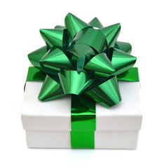 Gift box with ribbon and green bow isolated on the white background, clipping path included.