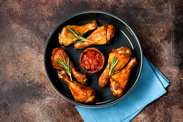 Grilled fried chicken legs with spicy sauce