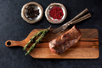 Roast beef on a wooden board