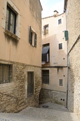 Fototapeta na wymiar Narrow alley in Girona, Catalonia, Spain