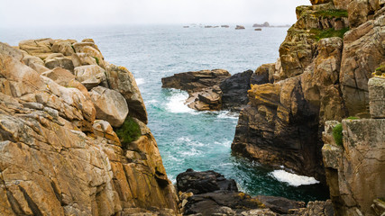 rocks on shore of Gouffre gulf of English Channel