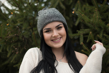 portrait of young woman smiling in winter clothes