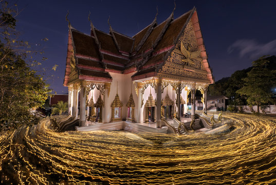 Ansahabucha, Buddhism Candlelight light trails of people walking around in Ansahabucha day at watvichit phuket, Thailand,