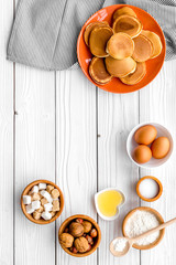 Ingredients for cook american pancakes on white wooden background top view copy space