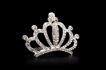 silver tiara isolated on a black background © vitaly tiagunov