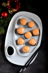 Homemade hot rolls baked with a sauce of two kinds of cheese.