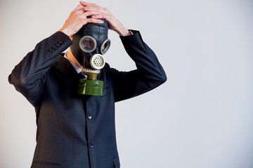 Businessman in a gas mask