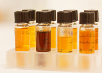 Small bottles with yellow liquid used in the lab for experiments