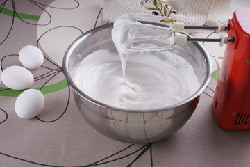 Bowl with whipped to solid peaks protein with sugar