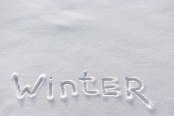 Word Winter is lettering on white snow