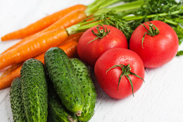 Ripe carrots, tomatoes, cucumbers in the fruit and vegetable market.