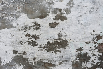 Wall fragment with scratches and cracks