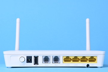 Wireless wite modem router network on blue background