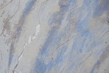 Wall fragment with scratches and cracks