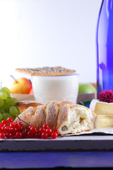 Cheese with mold, camembert with honey, purple bottle, Greek roll with cottage cheese, peanuts and pink flower, healthy food, milk in a glass with biscuits, pop art, retro style
