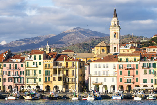 Oneglia colorful houses and the harbor, Imperia (Italy). Typical village of the Ligurian coast, mediterranean sea.