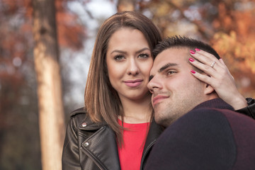 Fototapeta premium Lovely couple enjoying fall in love at park