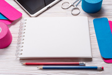 kinesiology, physiotherapy and therapeutic tape on doctor desk