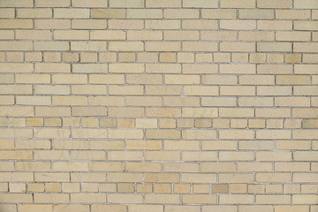 Obraz premium Old beige brick wall background texture