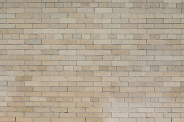 Old beige brick wall background texture