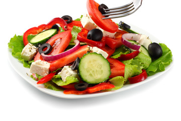 Square plate of greek salad isolated on white. fresh vegetable salad