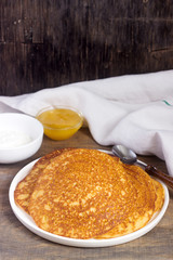 Coconut corn pancakes with honey. Rustic style.