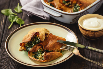 Pancakes filled with spinach and feta cheese.