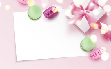 Colorful macaroons and gift box on pink background.