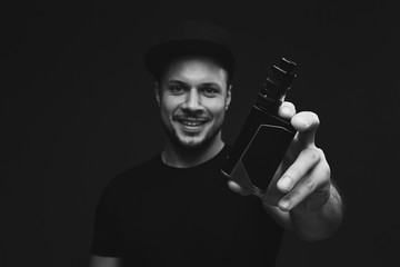 Vaping man and a cloud of vapor